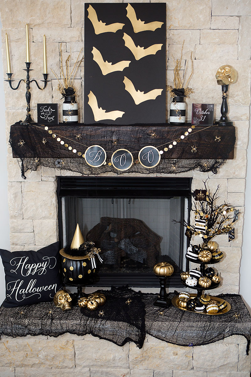 black and gold halloween mantel
